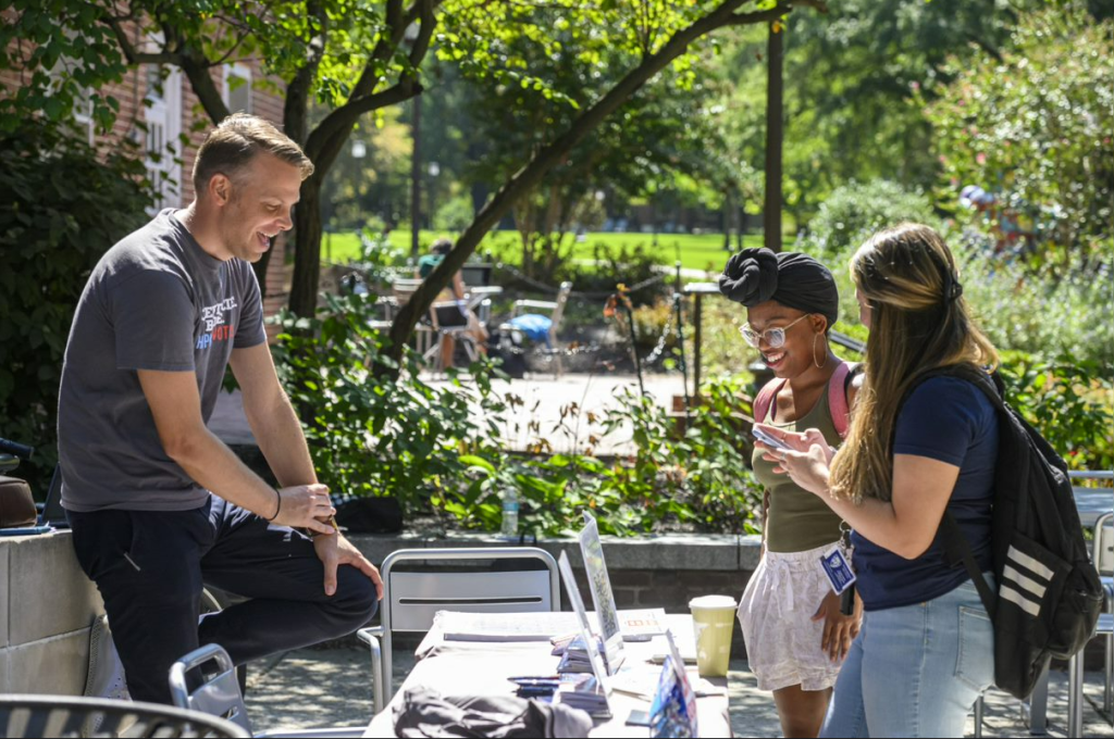 Whit smiling and tabling